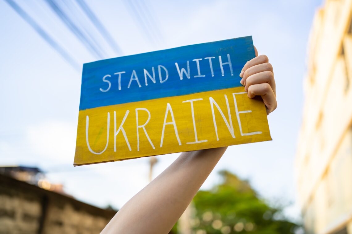 Fashion industry supports Ukraine - Stand with Ukraine on Blue and Yellow Sign